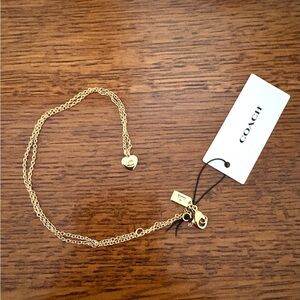 Coach Signature Raised C Heart Pendant Necklace. Gold Tone 18". NWT.